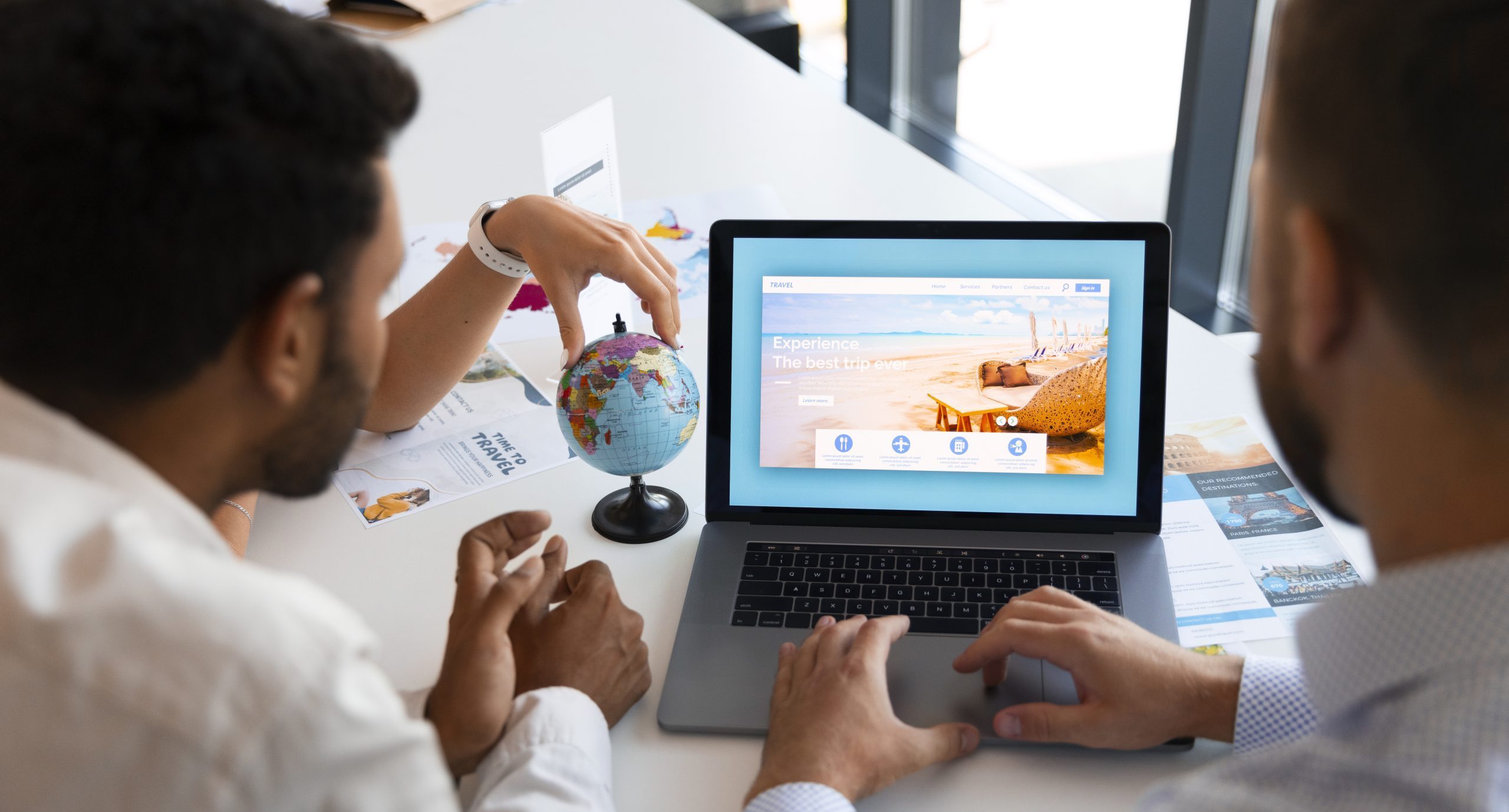 high-angle-man-working-travel-agency